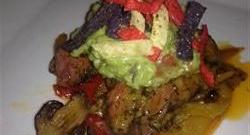 Filet Mignon with Bell Pepper Haystack and Fresh Guacamole Served with Corn Chips Photo