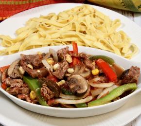 Sliced Steak, Peppers, and Mushrooms in the Oven Photo