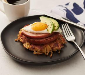 Bacon Potato Cakes with Ham Steak, Egg, and Sliced Avocado Photo